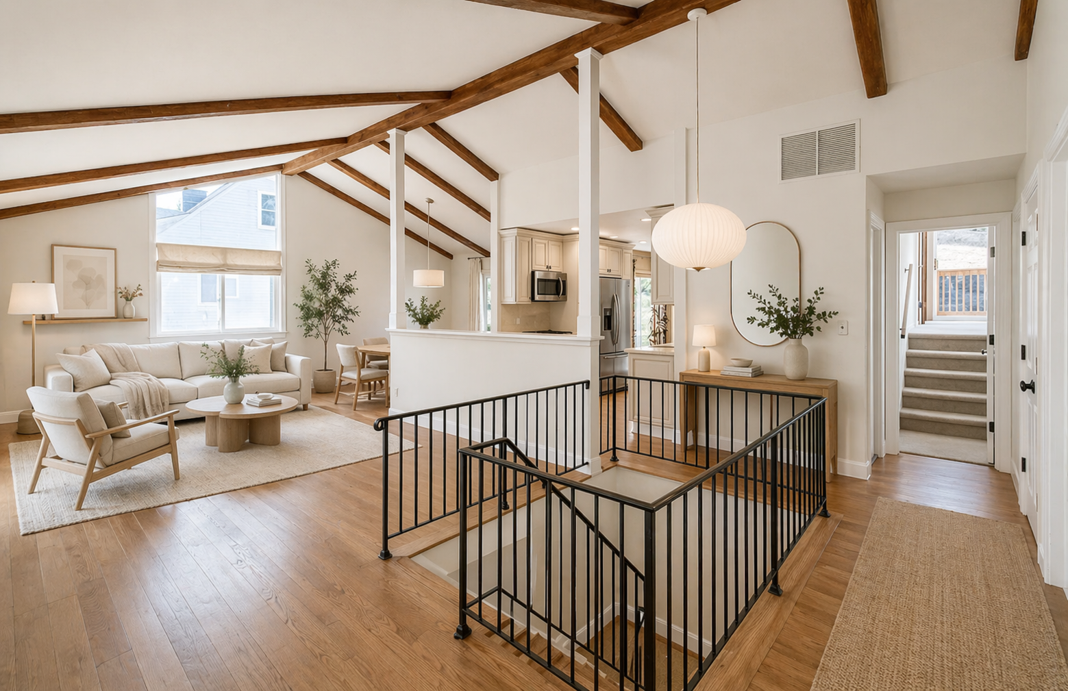 Staged great room with vaulted ceilings — modern farmhouse