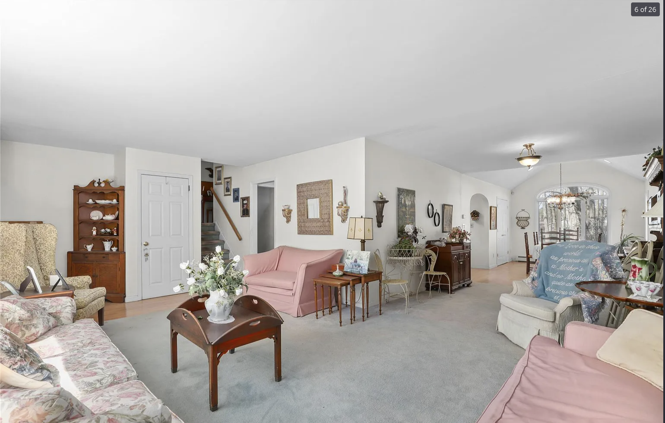 Cluttered dated living room before virtual staging